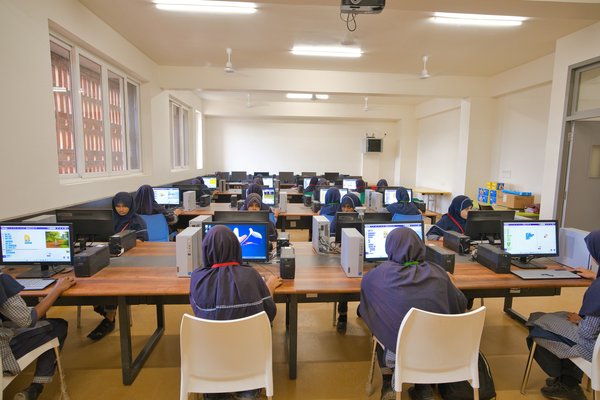 Students using computers in a modern technology classroom